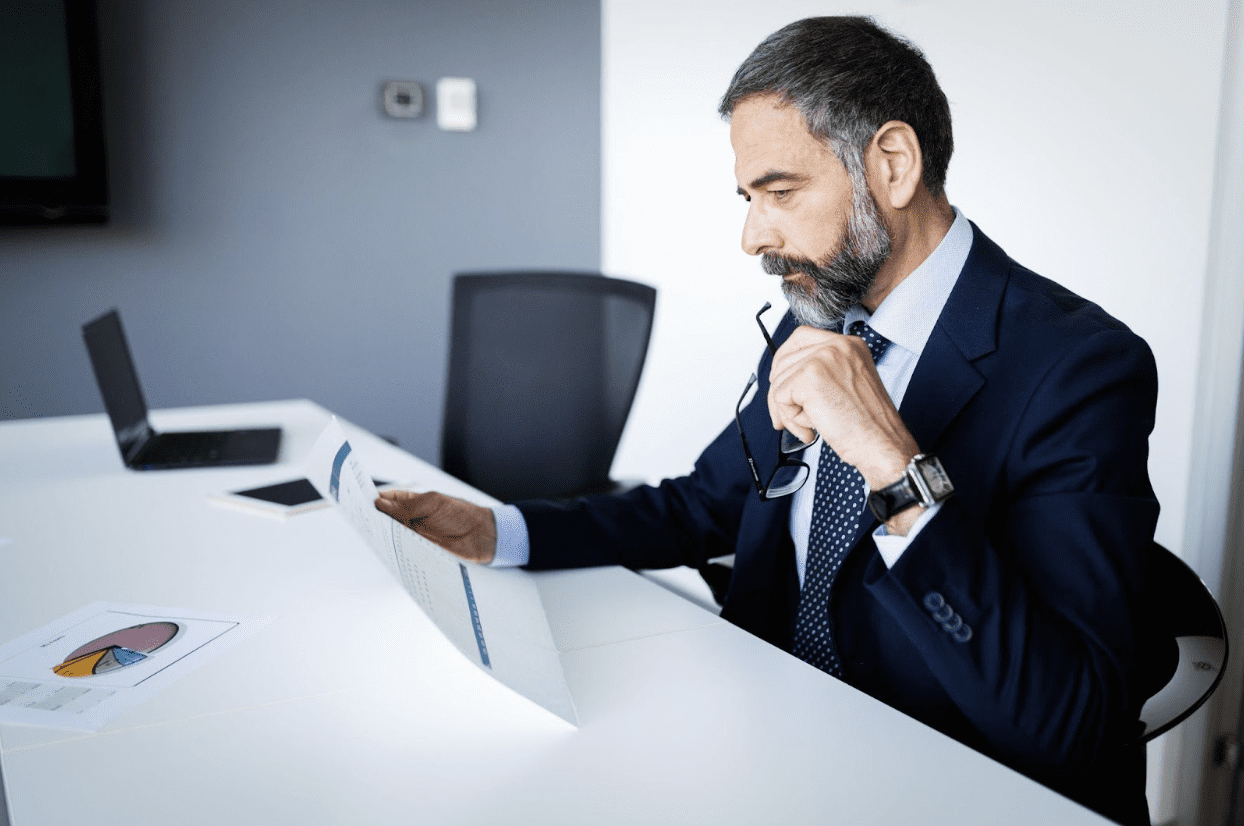 bookkeeper looking at record - Dental CPA bookkeeper looking at record