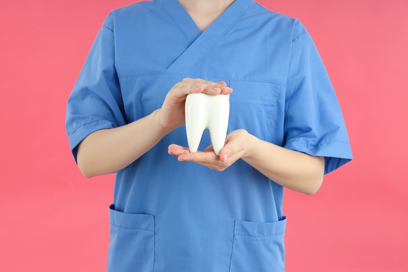 Concept of dental care on pink background